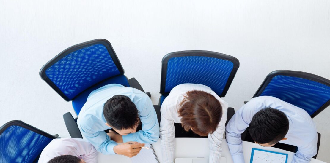 Business professionals discussing company insolvency and financial distress in a UK office