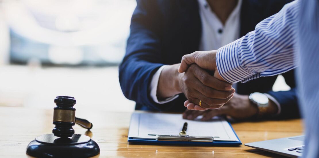 Business agreement and legal funding contract signing in a UK office